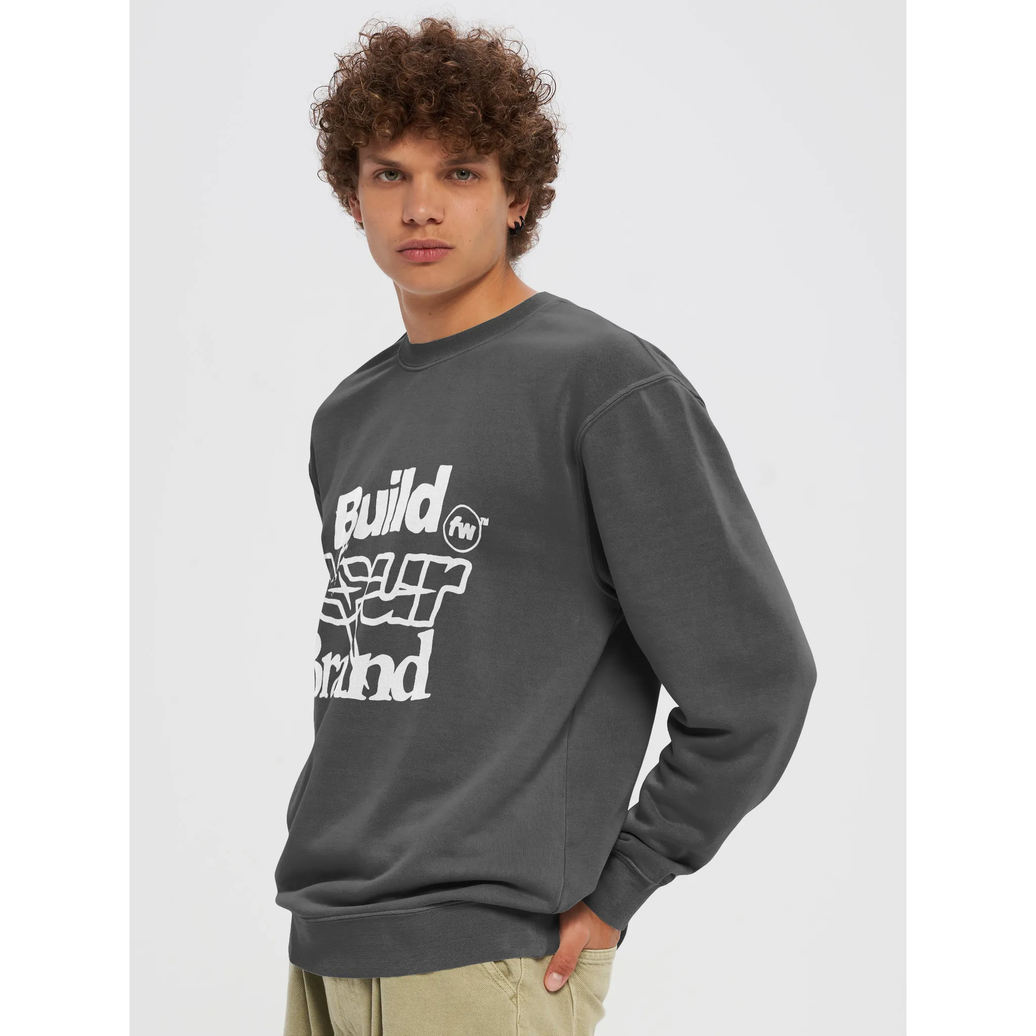 An image of a model wearing a Fourthwall branded crewneck, showing customization and model photography for images